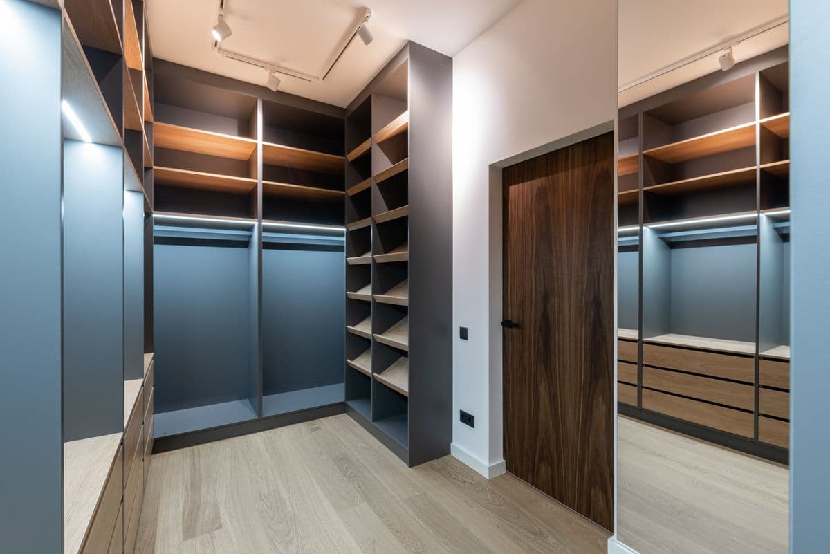 A fitted wardrobe with open shelving